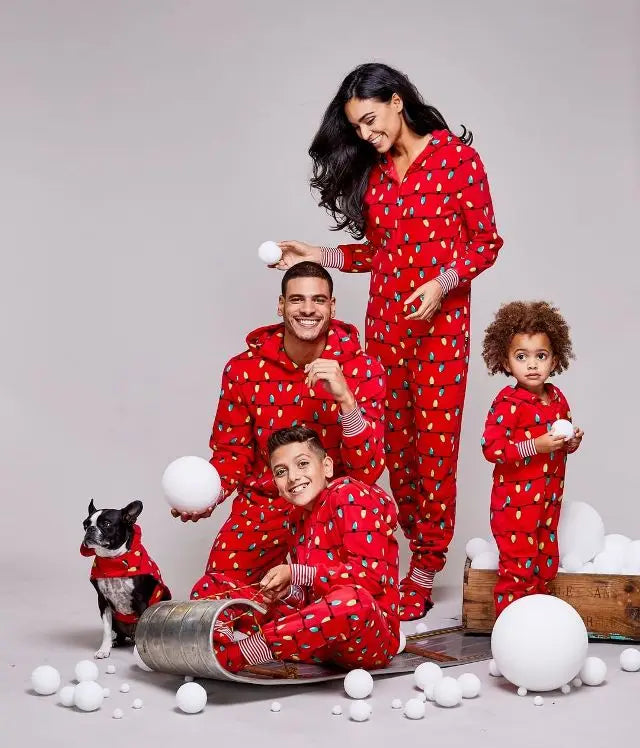 Family bonding in red-themed Christmas pajamas